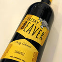 Wine bottle labeled 'Frisky Beaver' on a light background