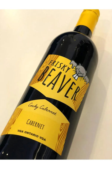 Wine bottle labeled 'Frisky Beaver' on a light background