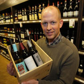 Ben MacPhee-Sigurdson face with wine
